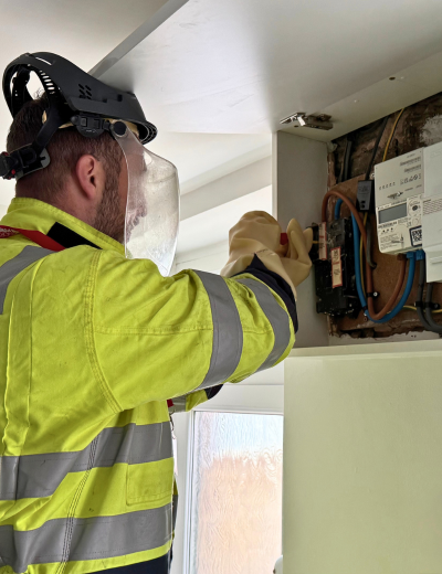 Engineer installing a smart meter